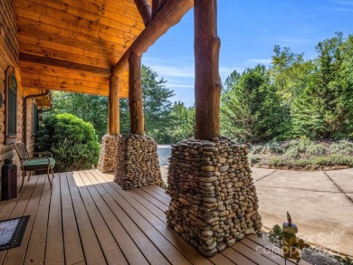 Classic log cabin, conveniently located behind the gates of on Rumbling Bald Resort on Lake Lure in North Carolina - for sale on GolfHomes.com, golf home, golf lot