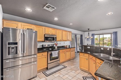 Nestled in the desirable Villages of Queen Creek, this home on Las Colinas Golf Club in Arizona - for sale on GolfHomes.com, golf home, golf lot