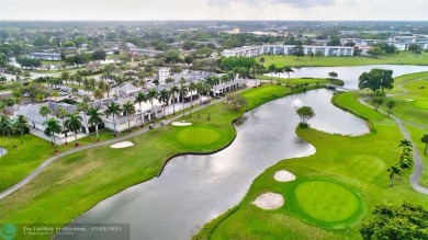 GORGEOUS NEWLY RENOVATED 2/2 IN PORTOFINO ISLE! IMPACT WINDOWS & on Wynmoor Golf Course in Florida - for sale on GolfHomes.com, golf home, golf lot