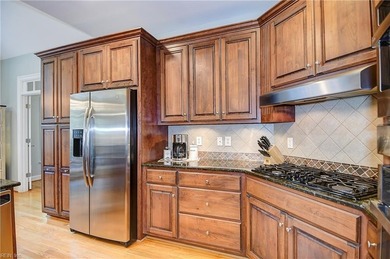 Discover effortless elegance in this custom brick home nestled on Riverfront Golf Club in Virginia - for sale on GolfHomes.com, golf home, golf lot