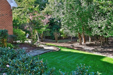 Discover effortless elegance in this custom brick home nestled on Riverfront Golf Club in Virginia - for sale on GolfHomes.com, golf home, golf lot