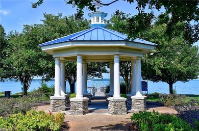 Discover effortless elegance in this custom brick home nestled on Riverfront Golf Club in Virginia - for sale on GolfHomes.com, golf home, golf lot