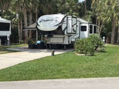 Nicely shaded Oak Cove Road RV property, including a storage on The Great Outdoors Golf and Country Club in Florida - for sale on GolfHomes.com, golf home, golf lot