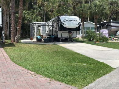 Nicely shaded Oak Cove Road RV property, including a storage on The Great Outdoors Golf and Country Club in Florida - for sale on GolfHomes.com, golf home, golf lot