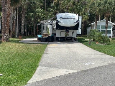 Nicely shaded Oak Cove Road RV property, including a storage on The Great Outdoors Golf and Country Club in Florida - for sale on GolfHomes.com, golf home, golf lot
