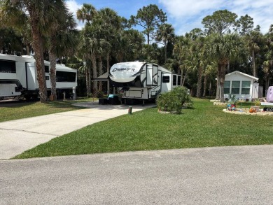 Nicely shaded Oak Cove Road RV property, including a storage on The Great Outdoors Golf and Country Club in Florida - for sale on GolfHomes.com, golf home, golf lot