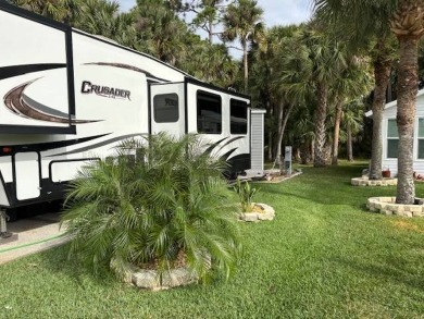 Nicely shaded Oak Cove Road RV property, including a storage on The Great Outdoors Golf and Country Club in Florida - for sale on GolfHomes.com, golf home, golf lot