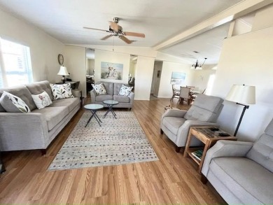 Beautifully maintained open-concept 2-bd/2-ba home is situated on Del Tura Golf and Country Club in Florida - for sale on GolfHomes.com, golf home, golf lot