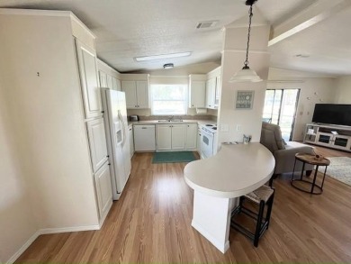 Beautifully maintained open-concept 2-bd/2-ba home is situated on Del Tura Golf and Country Club in Florida - for sale on GolfHomes.com, golf home, golf lot