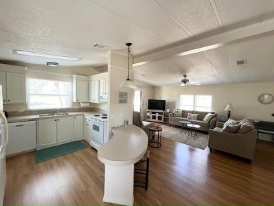 Beautifully maintained open-concept 2-bd/2-ba home is situated on Del Tura Golf and Country Club in Florida - for sale on GolfHomes.com, golf home, golf lot