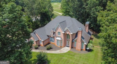 Welcome to your luxurious retreat nestled within the prestigious on Lake Spivey Golf Club in Georgia - for sale on GolfHomes.com, golf home, golf lot