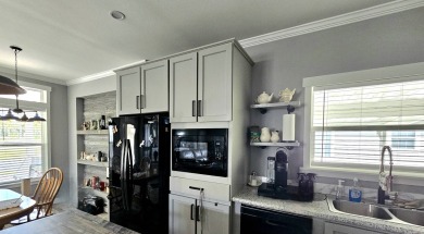 This 2020 farmhouse in Cypress Lakes Village offers 2 bedrooms on Big Cypress Golf and Country Club in Florida - for sale on GolfHomes.com, golf home, golf lot