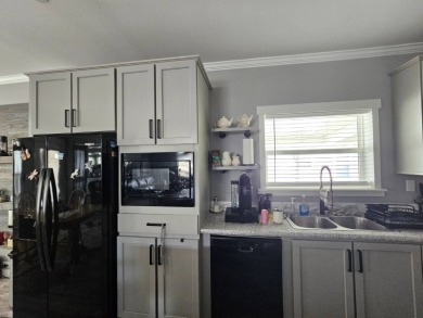 This 2020 farmhouse in Cypress Lakes Village offers 2 bedrooms on Big Cypress Golf and Country Club in Florida - for sale on GolfHomes.com, golf home, golf lot