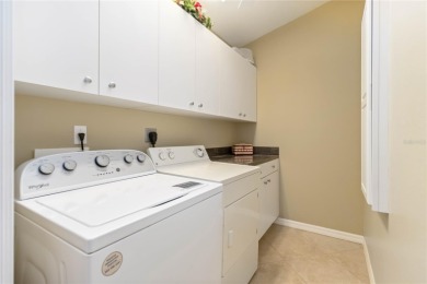 Located in the secure, private gated community of Sabal Trace on Sabal Trace Golf and Country Club in Florida - for sale on GolfHomes.com, golf home, golf lot