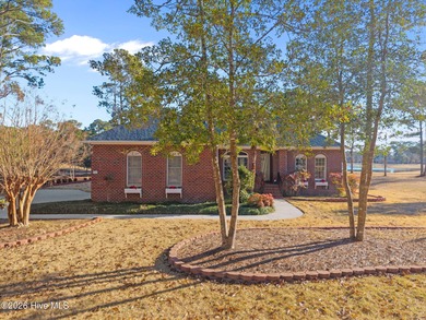 This all-brick ranch, 3-bedroom, 2-bathroom home has been on North Shore Country Club in North Carolina - for sale on GolfHomes.com, golf home, golf lot