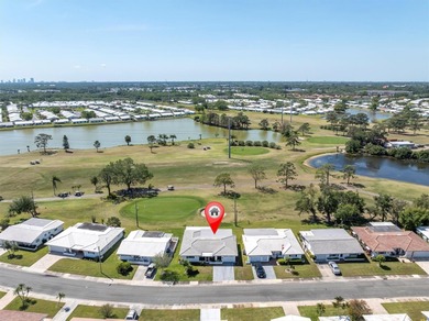 This stunning 2 bedroom, 2 bath, 1 car garage, 1649 sq. ft. home on Mainlands Golf Club in Florida - for sale on GolfHomes.com, golf home, golf lot