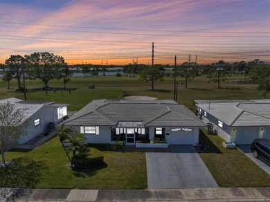 This stunning 2 bedroom, 2 bath, 1 car garage, 1649 sq. ft. home on Mainlands Golf Club in Florida - for sale on GolfHomes.com, golf home, golf lot