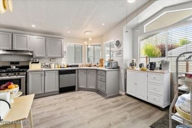 This charming and exceptionally well-maintained modular home is on Quail Wood Greens Golf Course in Arizona - for sale on GolfHomes.com, golf home, golf lot