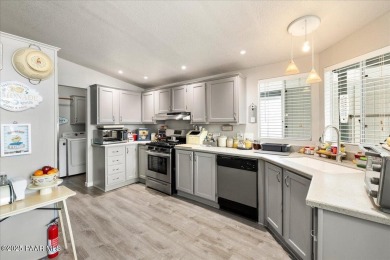 This charming and exceptionally well-maintained modular home is on Quail Wood Greens Golf Course in Arizona - for sale on GolfHomes.com, golf home, golf lot