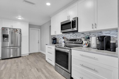 This stunning 2 bedroom, 2 bath, 1 car garage, 1649 sq. ft. home on Mainlands Golf Club in Florida - for sale on GolfHomes.com, golf home, golf lot