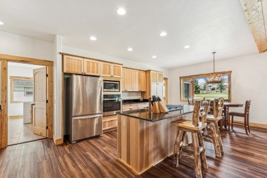 This superb single-level home overlooks the pond on the 14th on Eagle Bend Golf Course in Montana - for sale on GolfHomes.com, golf home, golf lot