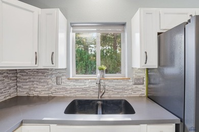 Listed by Lori Barnett, Engel & Volkers Black Hills, .   Nestled on Golf Club At Red Rock in South Dakota - for sale on GolfHomes.com, golf home, golf lot