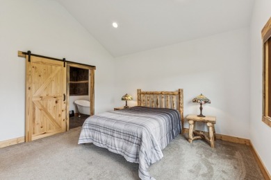 This superb single-level home overlooks the pond on the 14th on Eagle Bend Golf Course in Montana - for sale on GolfHomes.com, golf home, golf lot