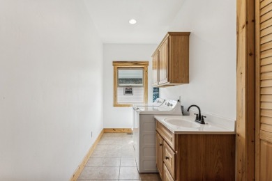 This superb single-level home overlooks the pond on the 14th on Eagle Bend Golf Course in Montana - for sale on GolfHomes.com, golf home, golf lot