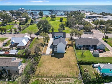 This raised house, perched gracefully on a 1-acre lot, offers an on Pass Christian Isles Golf Club in Mississippi - for sale on GolfHomes.com, golf home, golf lot