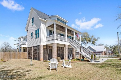 This raised house, perched gracefully on a 1-acre lot, offers an on Pass Christian Isles Golf Club in Mississippi - for sale on GolfHomes.com, golf home, golf lot