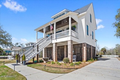 This raised house, perched gracefully on a 1-acre lot, offers an on Pass Christian Isles Golf Club in Mississippi - for sale on GolfHomes.com, golf home, golf lot