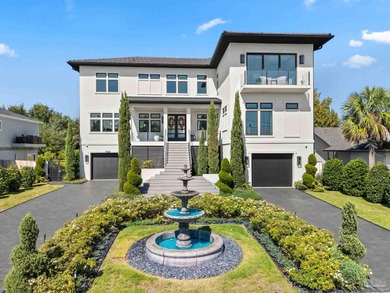 Experience modern coastal elegance in this architecturally on Tiger Point Golf and Country Club in Florida - for sale on GolfHomes.com, golf home, golf lot