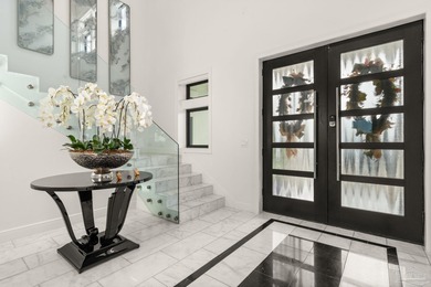 Experience modern coastal elegance in this architecturally on Tiger Point Golf and Country Club in Florida - for sale on GolfHomes.com, golf home, golf lot