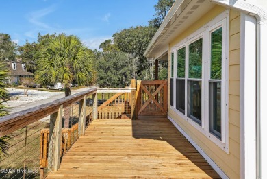 Welcome to waterfront living on Big Davis Canal! Looking out on Founders Club At St. James Plantation in North Carolina - for sale on GolfHomes.com, golf home, golf lot