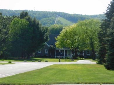 Beautiful level building site on .81 acres with views of Nubs on Boyne Highlands Golf Courses in Michigan - for sale on GolfHomes.com, golf home, golf lot