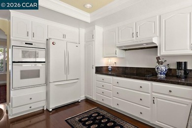 Located in desirable lagoon entry E1 this lower level Sierra on Rossmoor Golf Course in California - for sale on GolfHomes.com, golf home, golf lot