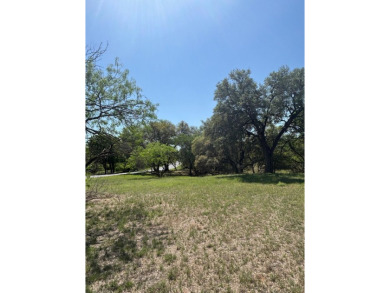 Large level lot in Horseshoe Bay West with great trees and on Ram Rock Golf Course in Texas - for sale on GolfHomes.com, golf home, golf lot