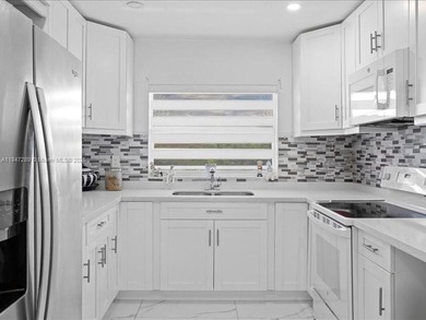 Luxury condo with 2 bedrooms, 2 bathrooms completely remodeled on Sunrise Lakes Phase IV Golf Course in Florida - for sale on GolfHomes.com, golf home, golf lot