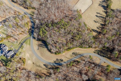Set within the gated community of Keswick Estate, this elevated on The Keswick Club in Virginia - for sale on GolfHomes.com, golf home, golf lot