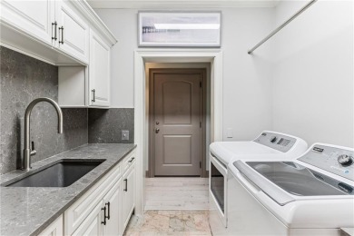 This stunning residence blends timeless European elegance with on Oak Grove Island Golf and Country Club in Georgia - for sale on GolfHomes.com, golf home, golf lot