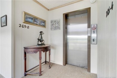 Gorgeous UPDATED Kitchen and Baths. Impact windows and tile on Martin County Golf Course in Florida - for sale on GolfHomes.com, golf home, golf lot