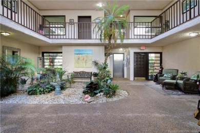 Gorgeous UPDATED Kitchen and Baths. Impact windows and tile on Martin County Golf Course in Florida - for sale on GolfHomes.com, golf home, golf lot