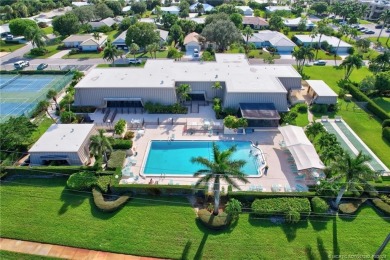 Gorgeous UPDATED Kitchen and Baths. Impact windows and tile on Martin County Golf Course in Florida - for sale on GolfHomes.com, golf home, golf lot