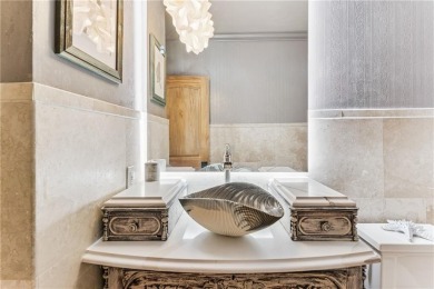 This stunning residence blends timeless European elegance with on Oak Grove Island Golf and Country Club in Georgia - for sale on GolfHomes.com, golf home, golf lot