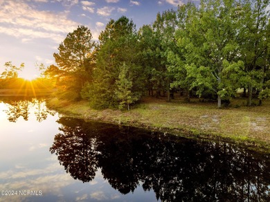 This large 0.65 acre wooded estate homesite is located in ''The on River Landing Golf Course in North Carolina - for sale on GolfHomes.com, golf home, golf lot