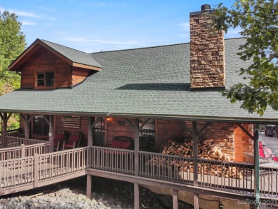 This magnificent log cabin boasting 3,200+ sq ft of heated on Rumbling Bald Resort on Lake Lure in North Carolina - for sale on GolfHomes.com, golf home, golf lot