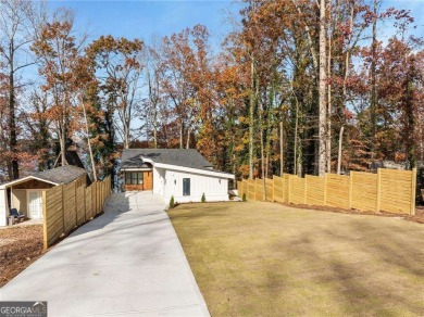 This stunning lakefront home on Lake Lanier offers effortless on Lanier Island Legacy Golf Couorse in Georgia - for sale on GolfHomes.com, golf home, golf lot