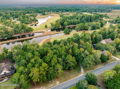 This .47 acre wooded residential homesite is in The Maple Creek on River Landing Golf Course in North Carolina - for sale on GolfHomes.com, golf home, golf lot