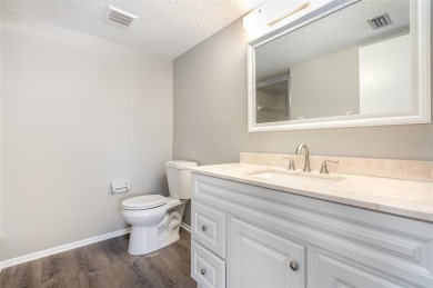 One or more photo(s) has been virtually staged. Charming upper on Capri Isle Golf Club in Florida - for sale on GolfHomes.com, golf home, golf lot