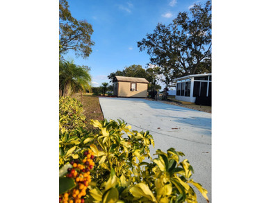 This tidy RV lot is perfect for the full time RVer or the on Deer Creek RV Golf Resort in Florida - for sale on GolfHomes.com, golf home, golf lot